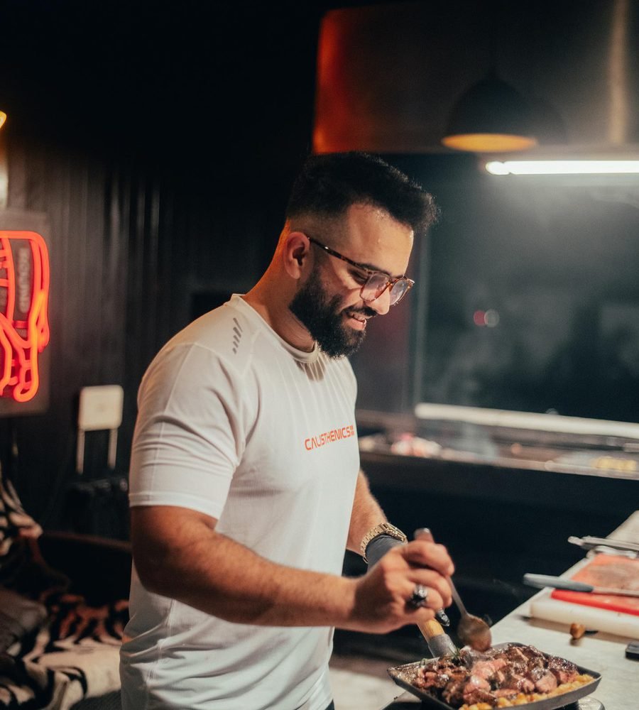 Chef Omer plating a steak at the grill
